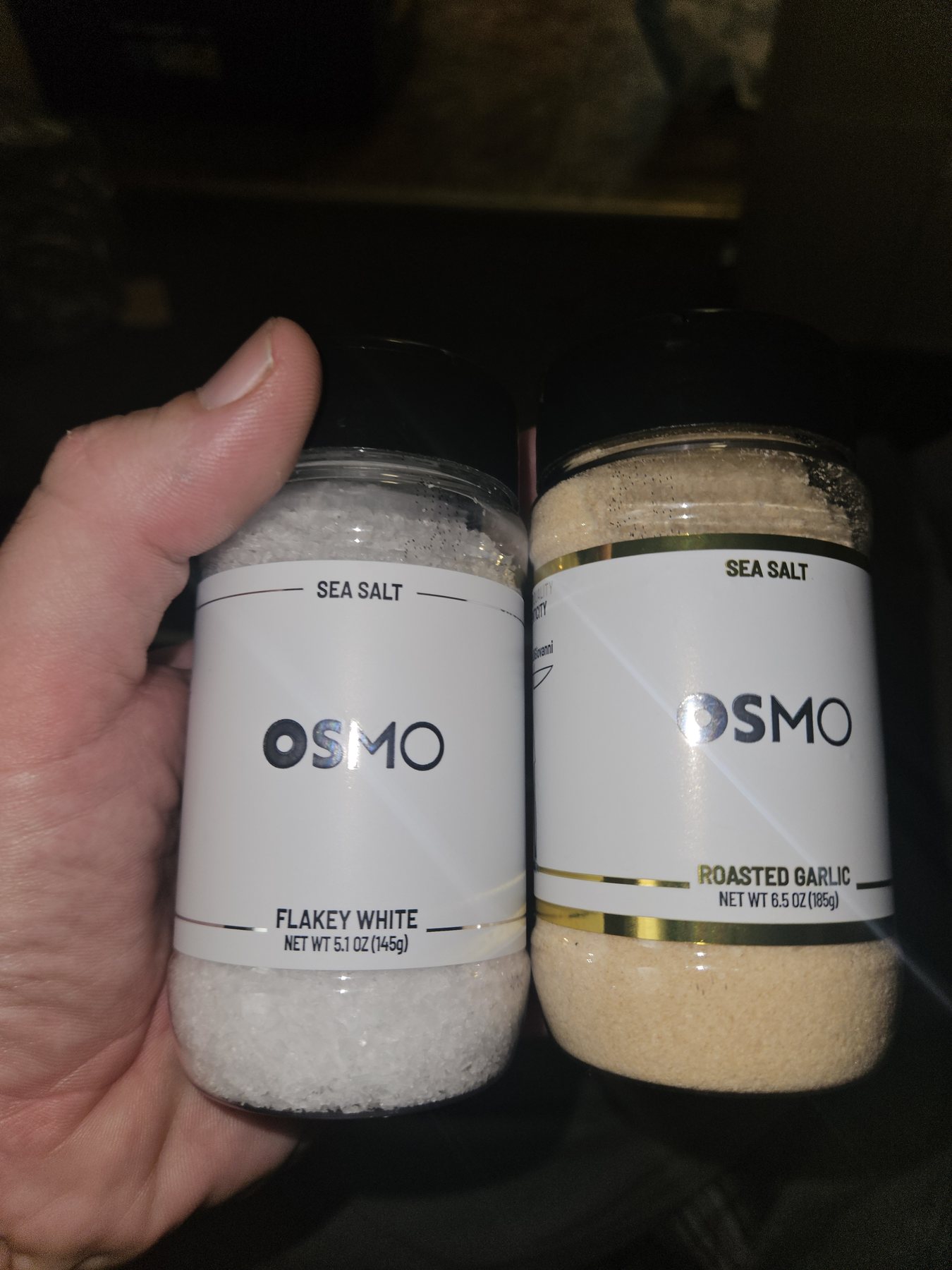 Two jars of OSMO sea salt held up to the camera