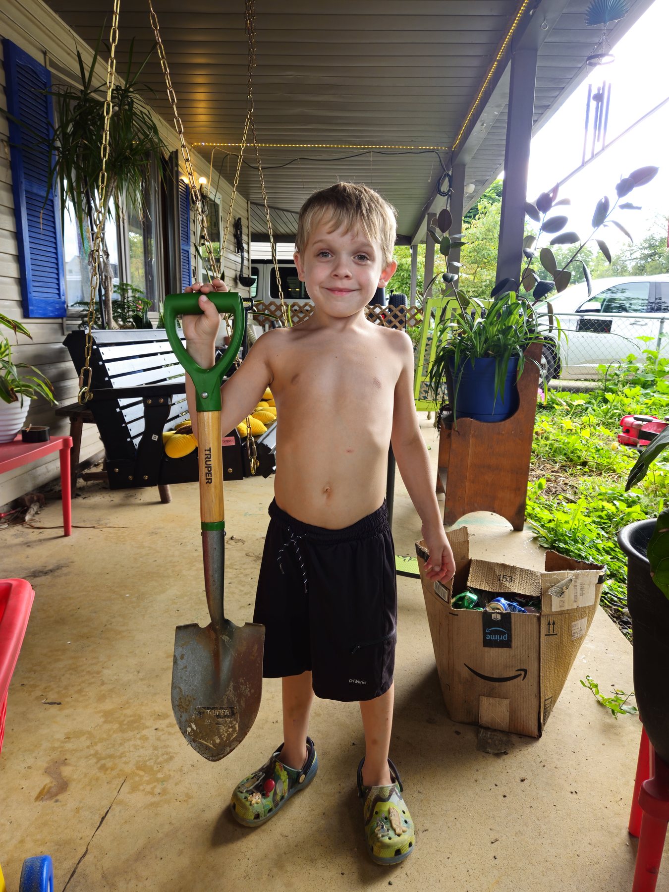 George proudly standing beside his well-used Truper shovel